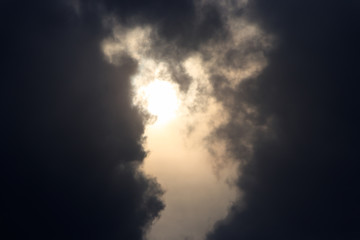 The sun breaks through the thunderclouds