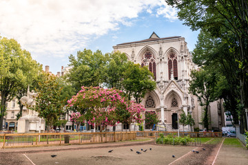 Public Billon park in sixth district of Lyon and view of the redemption church in France