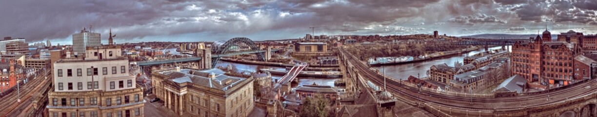 Panoramic landscape view of Newcastle upon Tyne's Central Station shot in HDR on an overcast summer daytime from the castle keep
