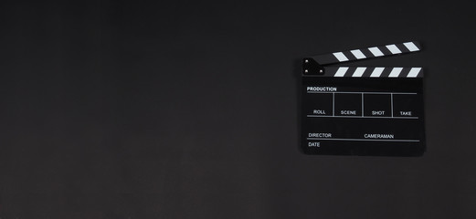 Clapperboard or clap board or movie slate use in video production ,film, cinema industry on black background.. - obrazy, fototapety, plakaty