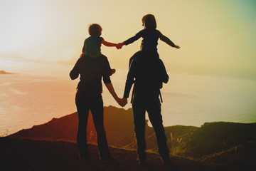 Fototapeta na wymiar happy family travel in mountains at sunset