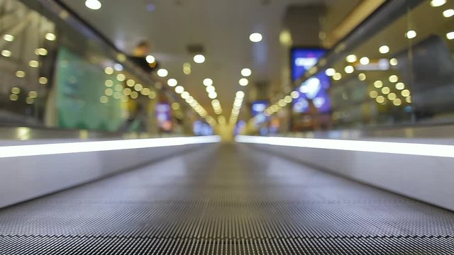 Closeup low angle video shot of empty conveyor belt at airport.