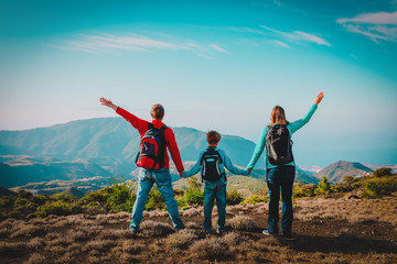happy family-mom, dad and son-travel in nature