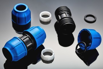 Set plumbing and tools on a green background.