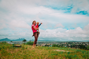 mother and son travel in Mauritius, looking at scenic view