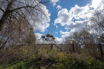old church in the forest and blue sky