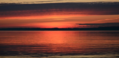 Fototapeta na wymiar Sunrise Sunset Ocean Sea Beach Horizon Orange Light Landscape Waves Clouds