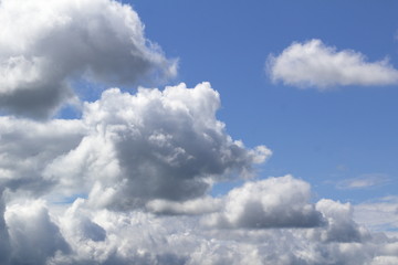 white Cumulus clouds against blue sky