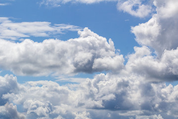 white Cumulus clouds against blue sky