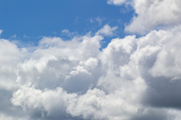 white Cumulus clouds against blue sky