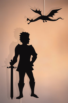 Dragon and knight shadow puppets.