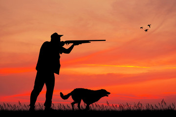 Fototapeta na wymiar man hunter at sunset