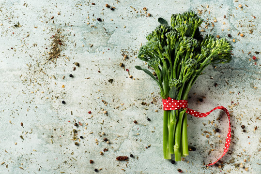 Bunch Of Broccolini On A Stone Surface