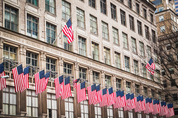 Line of American flags on the streets of Manhattan - New York City, NY