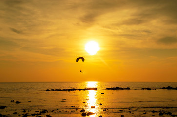 Extreme air sport on sunset on sea