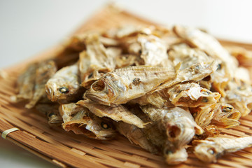 Dried fishes on bamboo sieve 