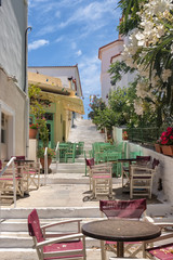 Obraz premium Cozy outdoor cafes in Chora town on Andros island, Cyclades