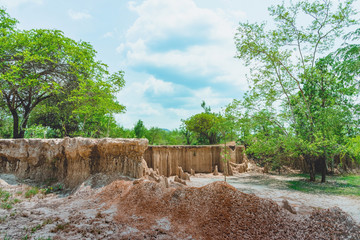 Fototapeta na wymiar Beautiful Scenery of Water flows through the ground have erosion and collapse of the soil into a natural layer at Pong Yub, Ratchaburi,Thailand.