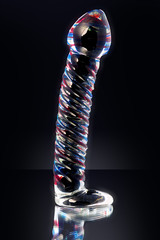 Clear colored Butt plug made of glass on a black background