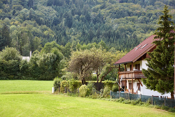 Obraz premium vintage rustic country house in a picturesque place.