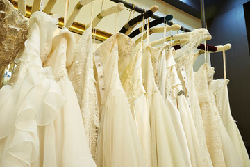 White wedding dresses on rack 