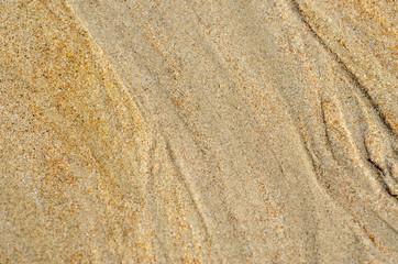 Sand on the beach with blurred pattern background