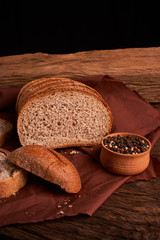 Peppercorns in a wooden bowl on table with food rustic style. Homemade food
