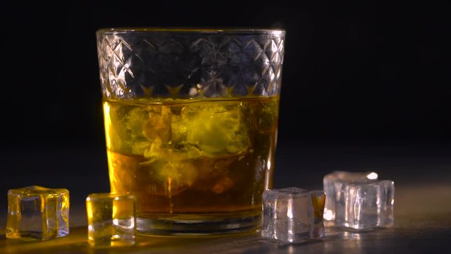 Whiskey in glass with cubes of ice