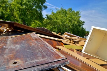 waste of Old and used construction material and old wood on dump site. Ecology background or...