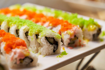 Sushi rolls with tobiko on top 