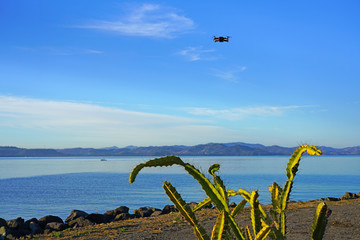 Flying a red drone camera in the sky in Papagayo, Guanacaste, Costa Rica