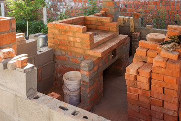 Construction of a brick fireplace in a gazebo