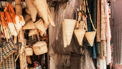 Meghalaya handicrafts art and crafts made with cane and bamboo products. Bamboo Cane work, Stools, Baskets, fishing traps, containers for display in Handloom and Handicraft Market in Meghalaya.