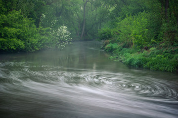 Obraz premium Whirl on the river at spring