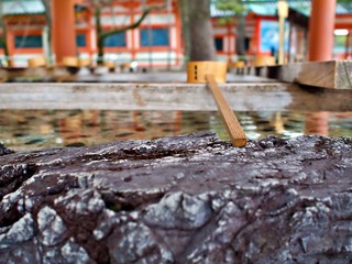 Japanese style Traditional bamboo ladle with basin stone edge at Hean Temple, Japan