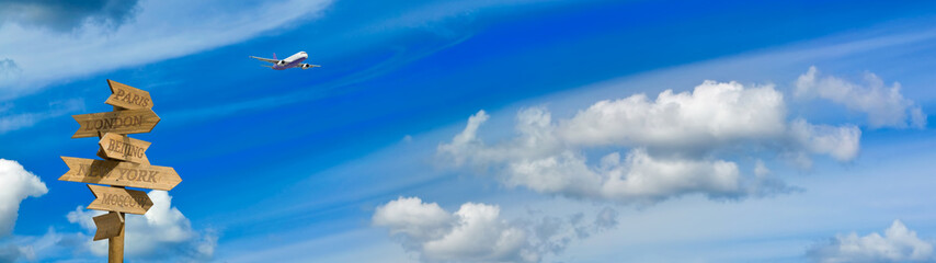 images of a pointer with cities and a plane in the sky