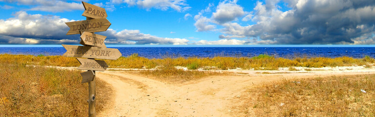 image pointer with cities against the crossroads of two roads and the sea © cooperr