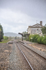 Fototapeta na wymiar View of train line, rainy day, Obidos train station as background