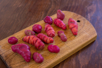 Andean Potatoes Varieties - cutting board - red