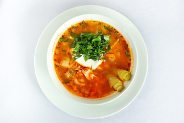 Pickle soup. Classic Russian soup, with cucumber and sour cream. Top view.