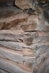 Vintage log and sod roof barn and farm equipment and tools