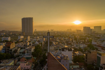 Modern Church Spire against City Scape Sunset