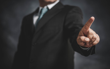 businessman touching the screen with his hand