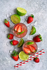 Homemade strawberry lemonade with lime. Top view with copy space.