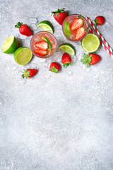 Homemade strawberry lemonade with lime. Top view with copy space.