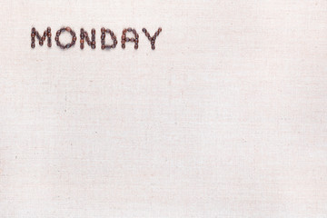 The word Monday written with coffee beans , aligned at the top left.