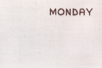 The word Monday written with coffee beans , aligned at the top right.