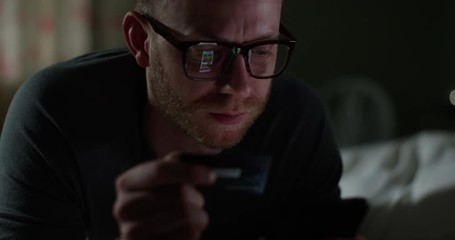 4K Closeup Caucasian man using smartphone & credit card, shopping online. Slow motion.