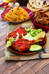 Traditional Indian food chicken tandoori and Tikka with garlic naan