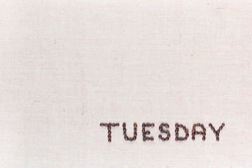 The word Thursday written with coffee beans , aligned at the bottom right.